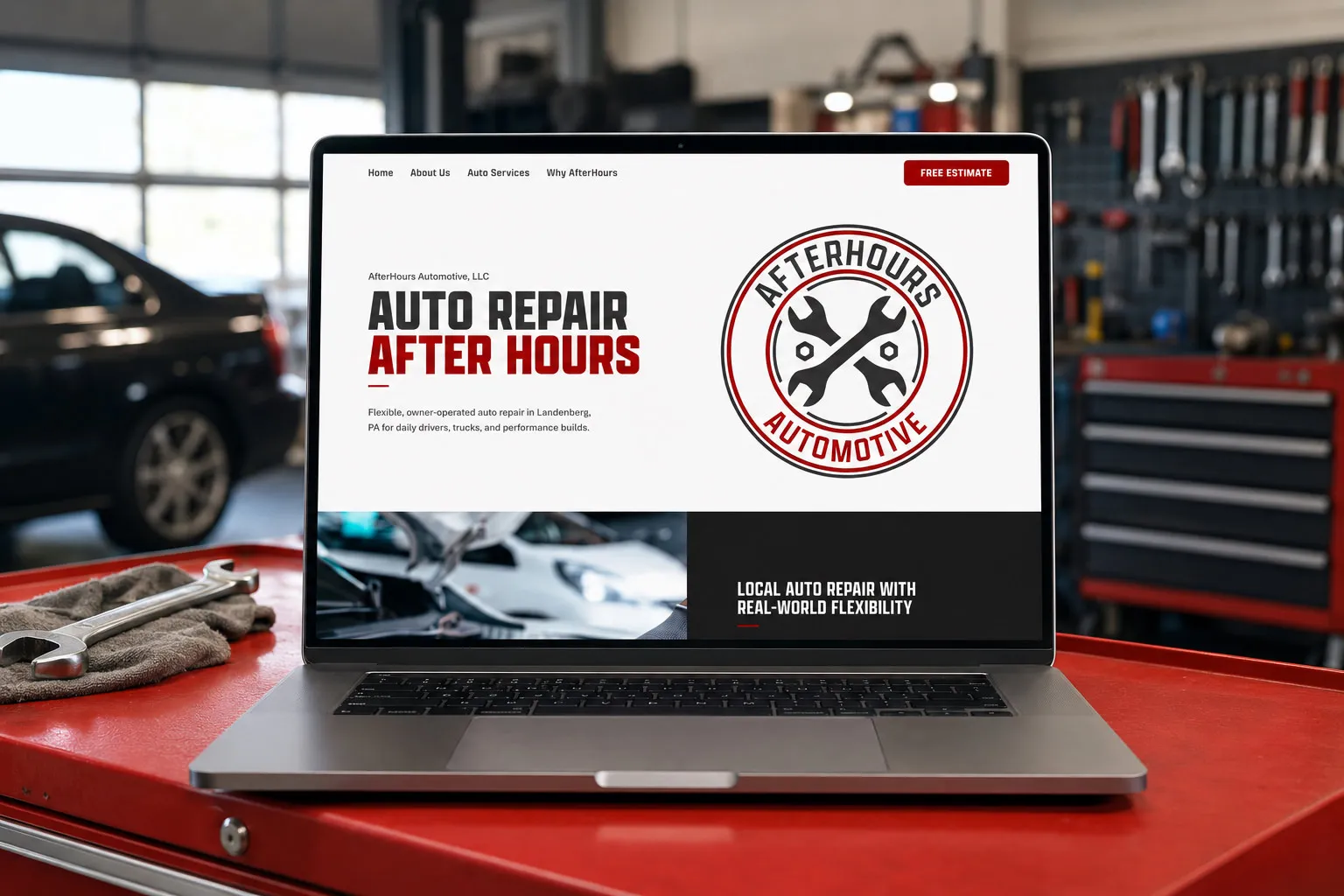 AfterHours Automotive single-page website shown on a laptop in an auto repair shop